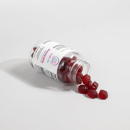 GlamLabs Gummies for Healthy Joints spilling from clear bottle Supplements for Joint Pain Relief and Mobility