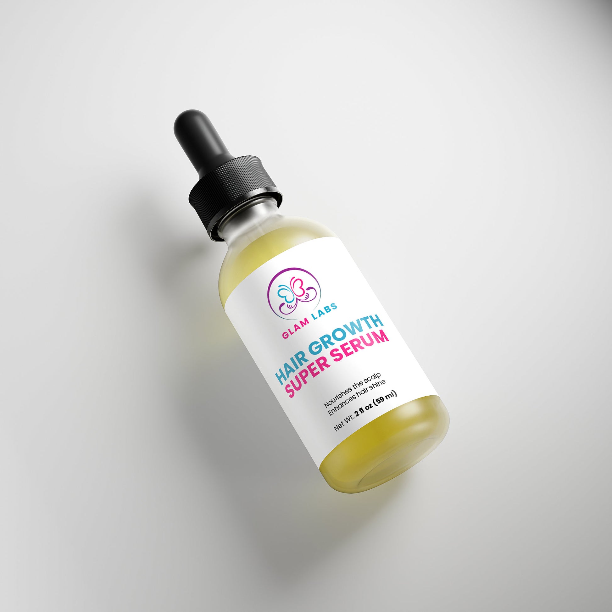 Glam Labs dropper bottle of Hair Growth Super Serum with yellow oil formula angled on white background