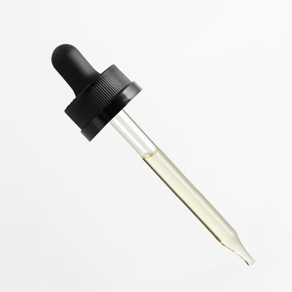 Glam Labs Hair Growth Super Serum glass dropper with light golden serum for targeted scalp application